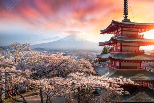 Fujiyoshida, Japan Beautiful view of mountain Fuji and Chureito pagoda at sunset, japan in the spring with cherry blossoms photo