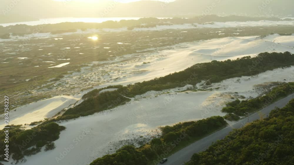 Sand dunes sunset at Praia Da Joaquina, Florianopolis city, Santa Catarina, Brazil Sand dunes sunset at Praia Da Joaquina, Florianopolis city, Santa Catarina, Brazil