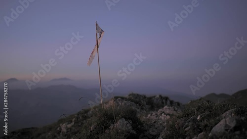 Filming the sunset from the top of Oslea mountain in Romania photo