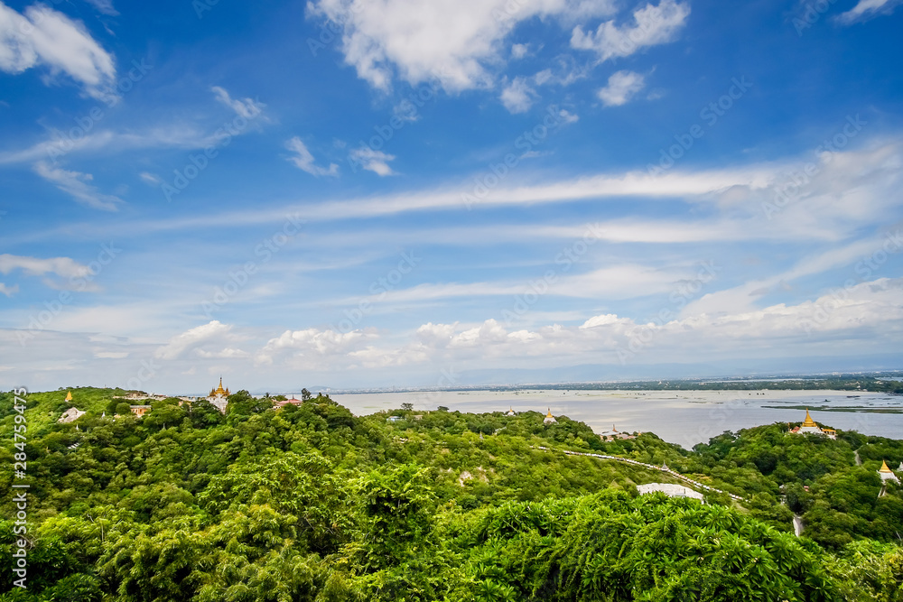 aerial view of Mandalay city with temples, gold pagoda, Irrawaddy river and bridges from sagaing hill. landmark and popular for tourists attractions in Myanmar aerial view of Mandalay city with temples, gold pagoda, Irrawaddy river and bridges from sagaing hill. landmark and popular for tourists attractions in Myanmar