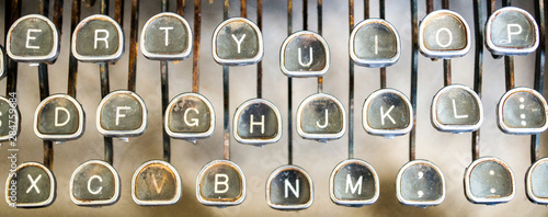 Quadro su tela close up of three rows of letter keys on a vintage rusted typewriter viewed from