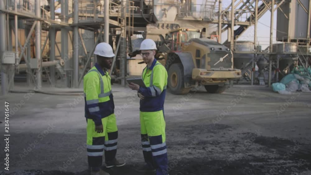 Technicians with tablet at construction site Technicians with tablet at construction site