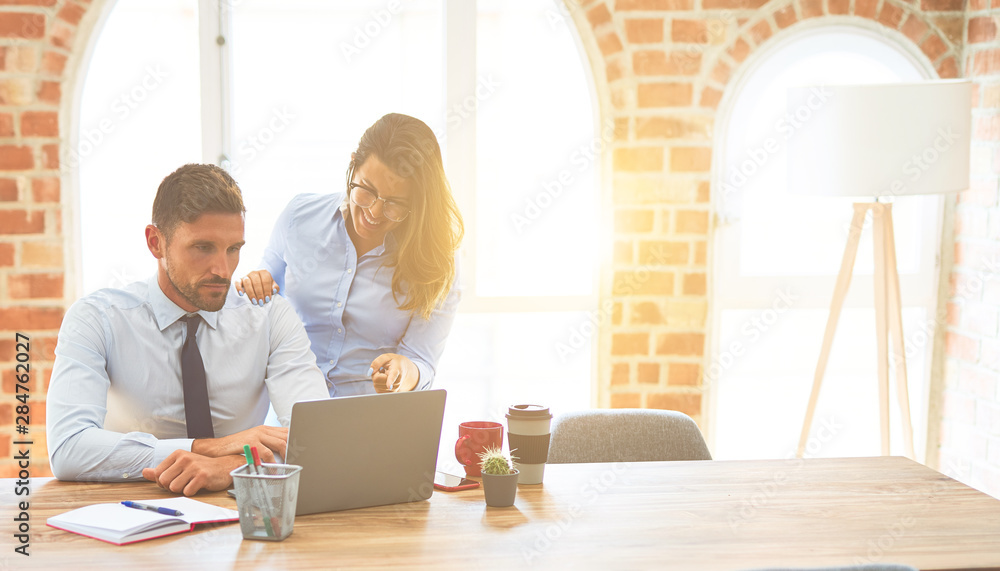 Young business team of woman and man working together at the office Young business team of woman and man working together at the office