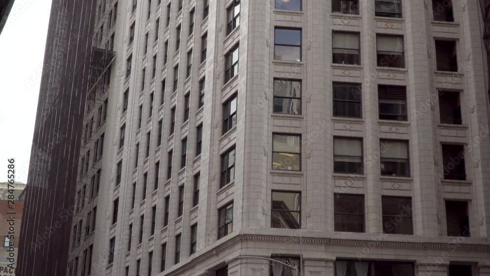 Typical day time exterior establishing shot of generic apartment or office building in urban city New York style shot in 4K DX. Typical day time exterior establishing shot of generic apartment or office building in urban city New York style shot in 4K DX.
