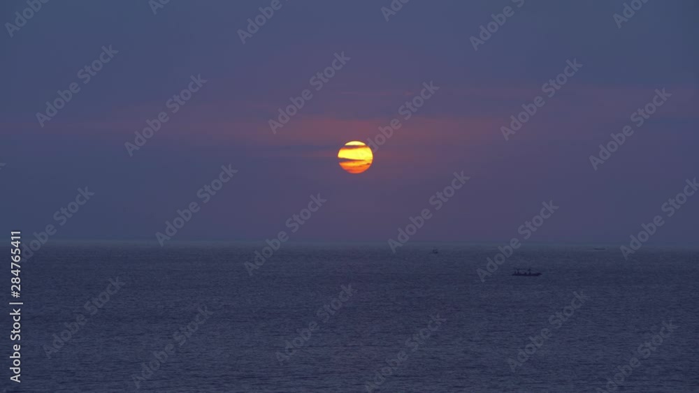 Little boat sailing in the ocean during sunset. Little boat sailing in the ocean during sunset.