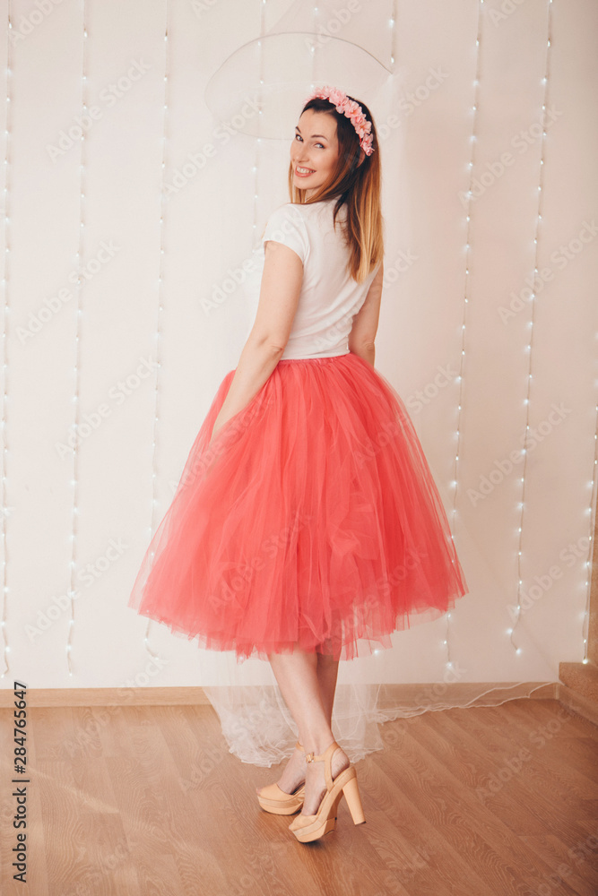 isolated photo: beautiful model with long hair shows off clothes. the concept of modeling business, is casual clothes isolated photo: beautiful model with long hair shows off clothes. the concept of modeling business, is casual clothes