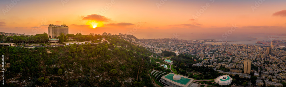 Aerial panorama of sunset over Haifa and the Bahai temple complex in Israel