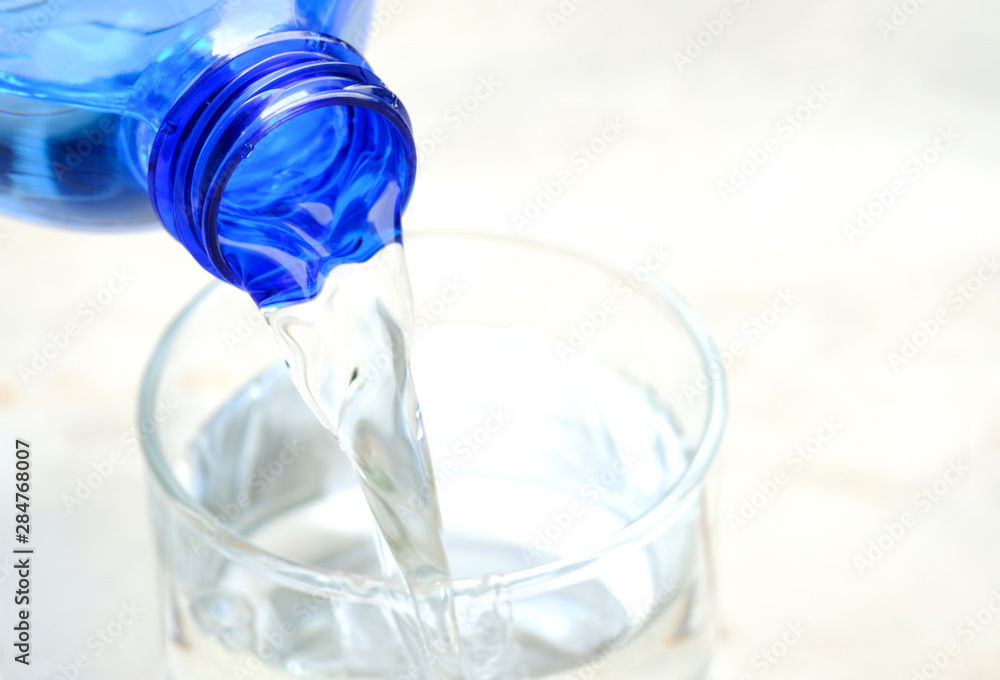 Clean water for good health. Pouring Fresh Pure Water From Pitcher Into A Glass on table wooden. Health And Diet Concept. Lifestyle Healthcare And Beauty. Clean water for good health. Pouring Fresh Pure Water From Pitcher Into A Glass on table wooden. Health And Diet Concept. Lifestyle Healthcare And Beauty.