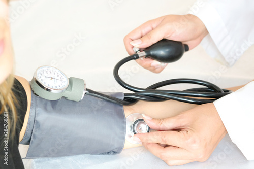 Doctor woman check blood pressure monitor and heart rate monitor pressure gauge. Health care and  Medical concept