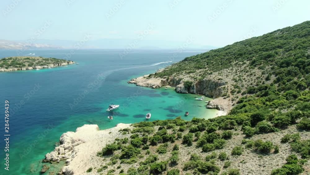 A drone video of a neighbour island of Krk. A cove full of boats is filmed. A drone video of a neighbour island of Krk. A cove full of boats is filmed.