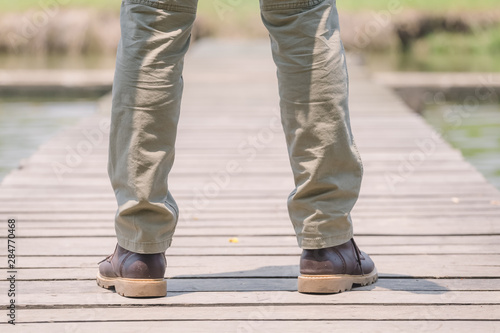 Model wearing sofe green color cargo pants or cargo trousers