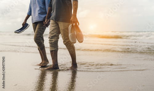 Couple senior elder retire resting relax walking at sunset beach honeymoon family together happiness people lifestyle photo