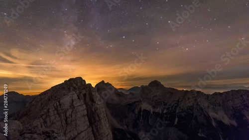 Milky way time-lapse shot from Mojstrovka ridge just under the top of Mt. Velika Mojstrovka. Peaks in the distance are Zadnja Mojstrovka on the left, Jalovec in the middle and Mangart on the right. photo