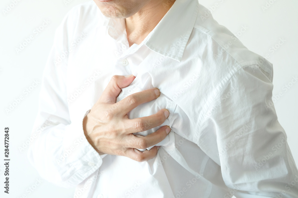 Heart attack, Man standing chest pain in the bedroom Health concept Heart attack, Man standing chest pain in the bedroom Health concept