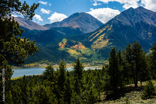 Colorful Rocky Mountain Slopes Rise Above Lake