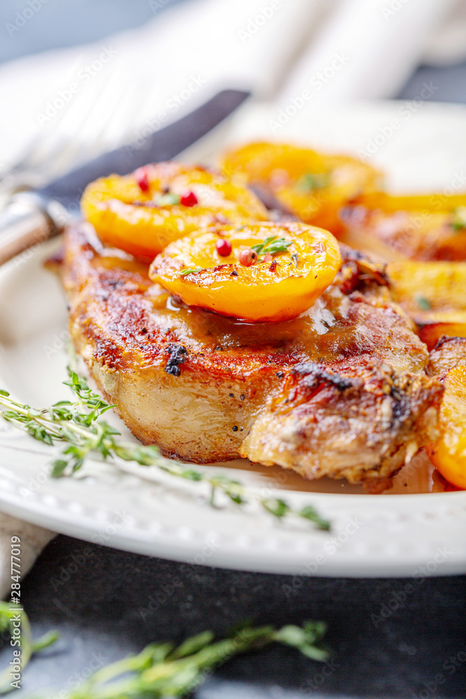 Juicy pork steak with apricots,thyme and potatoes. Juicy pork steak with apricots,thyme and potatoes.