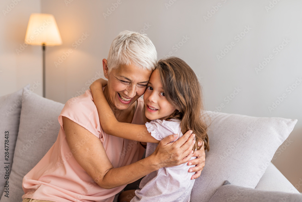 Φωτογραφία Happy grandmother and granddaughter embracing, touching foreheads, enjoying tender moment, sitting together at home, grandma and grandchild spending time together
