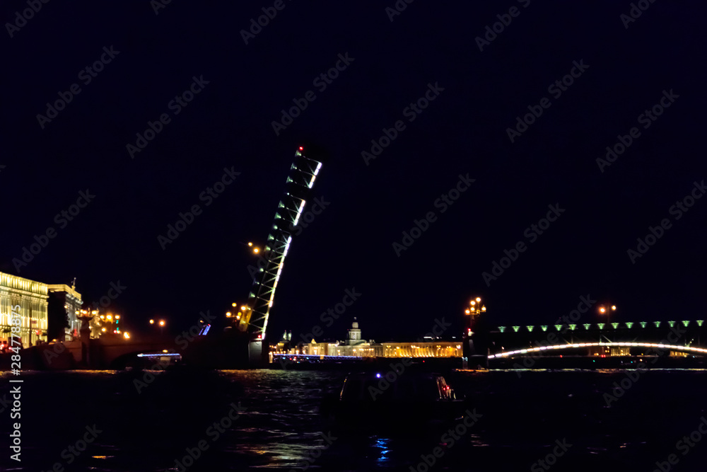 Opening of Trinity drawbridge. Night view of Trinity bridge from the Neva river in St. Petersburg, Russia