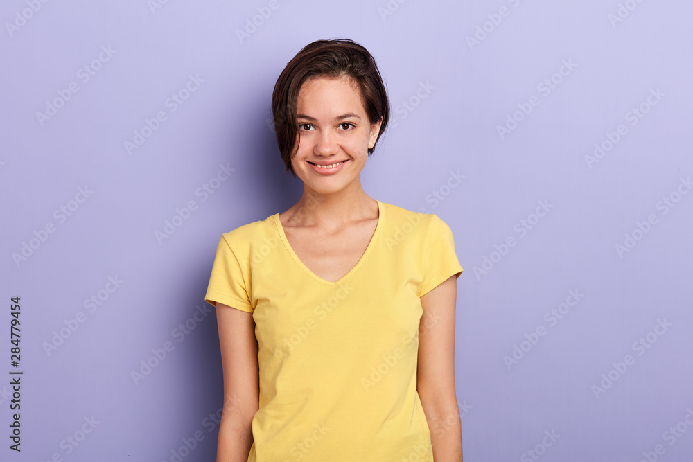 cheerful smiling girl with short black hair showing her white teeth to camera while feeling happy and carefree. close up portrait, beauty concept. cheerful smiling girl with short black hair showing her white teeth to camera while feeling happy and carefree. close up portrait, beauty concept.