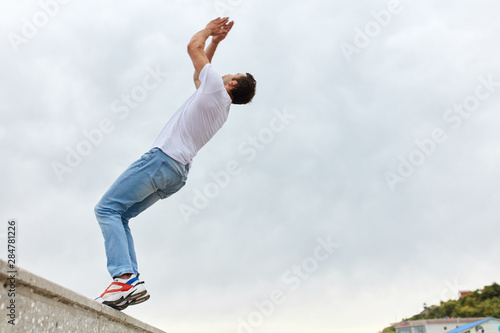 handsome strong man going to do a difficult stunt, copy space. full length photo.lifestyle