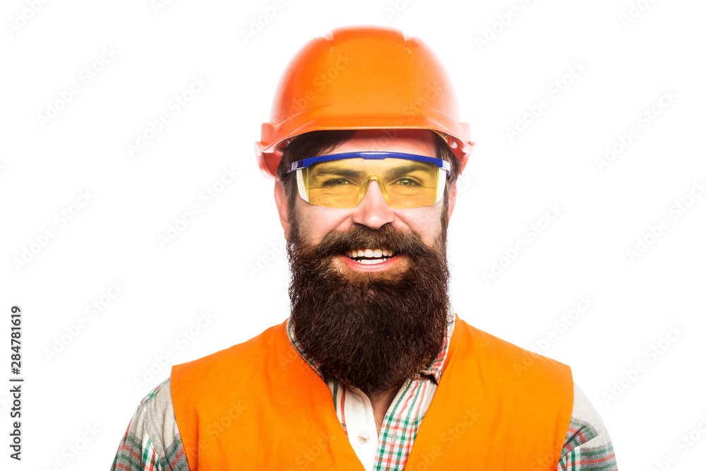 Portrait of a builder smiling. Builder in hard hat, foreman or repairman in the helmet. Bearded man worker with beard in building helmet or hard hat. Man builders, industry. Building glasses Portrait of a builder smiling. Builder in hard hat, foreman or repairman in the helmet. Bearded man worker with beard in building helmet or hard hat. Man builders, industry. Building glasses