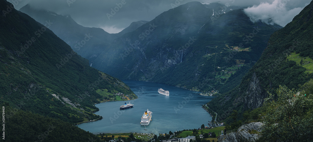 Cruise ships docking at the Geiranger fjord in Norway