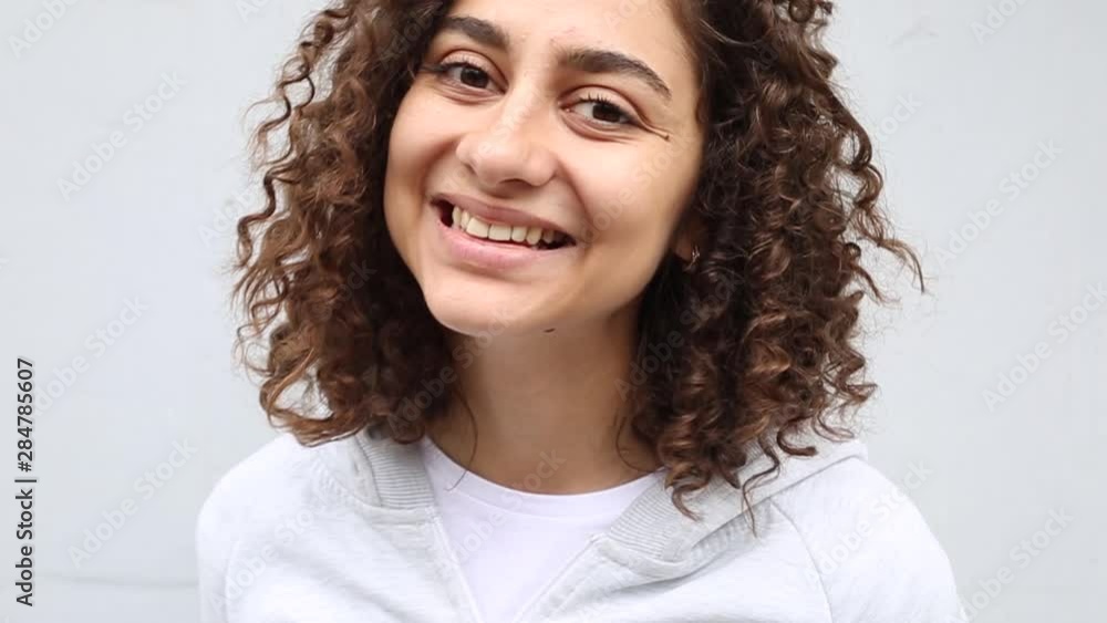 Portrait of a smiling Indian girl. Closeup of a happy young brunette woman with beautiful eyes. Portrait of a smiling Indian girl. Closeup of a happy young brunette woman with beautiful eyes.