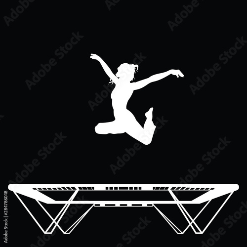 Young female athlete is doing gymnastics on a trampoline