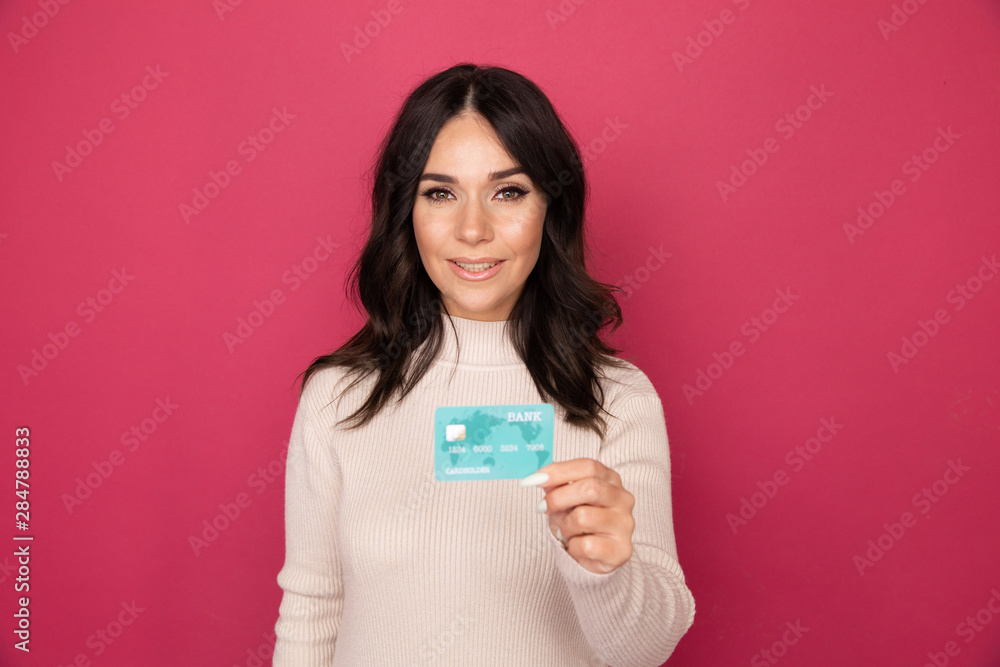 Advertising concept. Lady smiling and showing credit card isolated Advertising concept. Lady smiling and showing credit card isolated