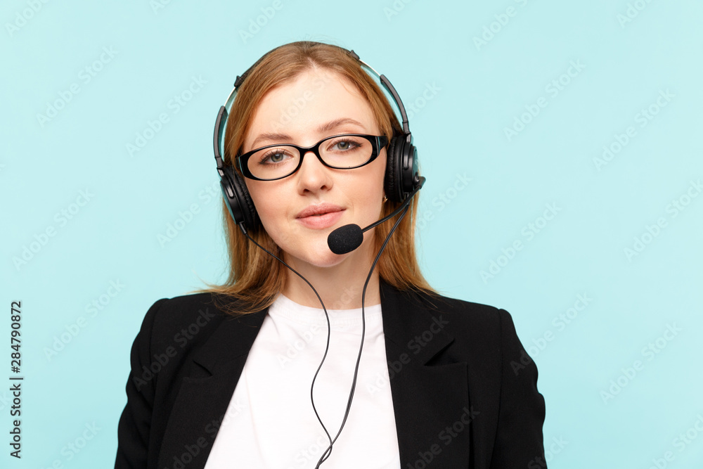 Happy female call center operator in the blue studio Happy female call center operator in the blue studio