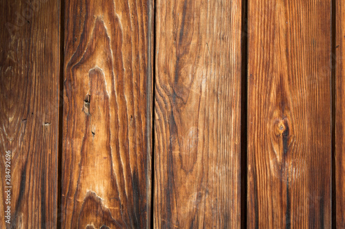 Brown wooden background from old yellow black planks
