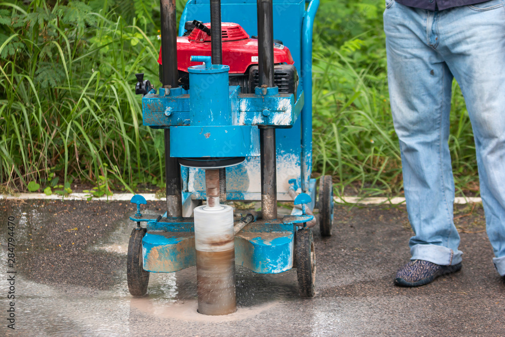 Engineering is drilling the road by Road drilling machine for Check road standards Engineering is drilling the road by Road drilling machine for Check road standards
