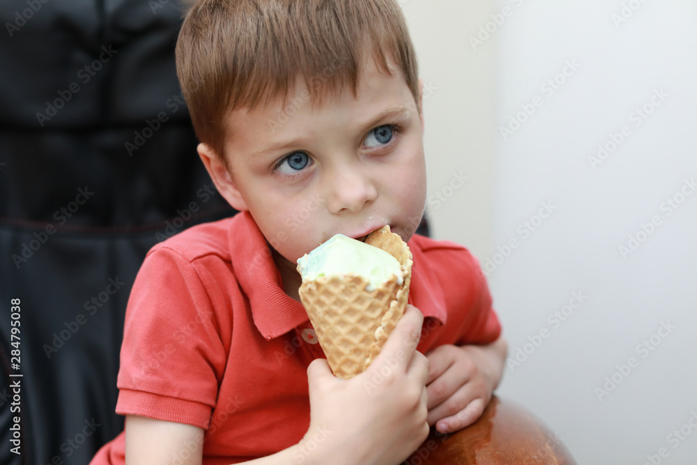 Boy biting ice cream