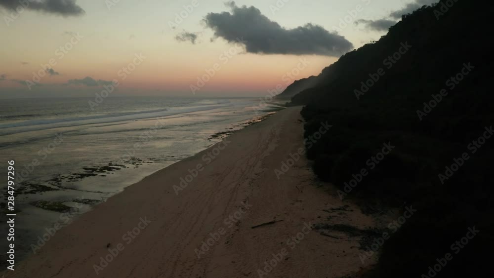 Aerial drone view of sandy beach during beautiful golden sunset Aerial drone view of sandy beach during beautiful golden sunset