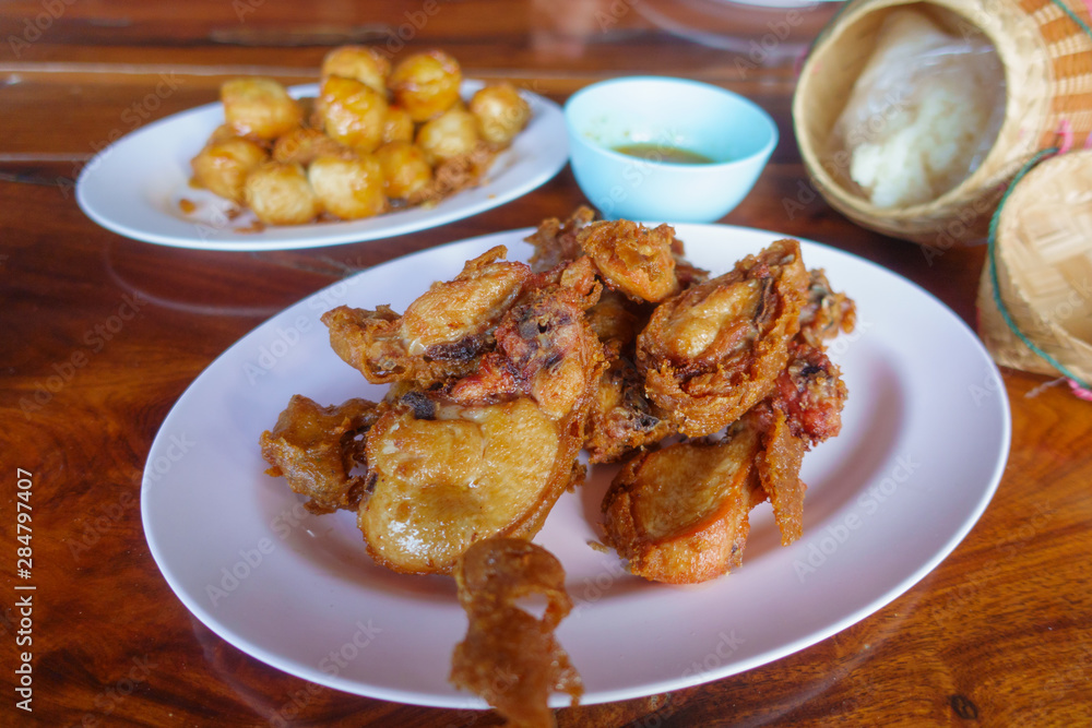 Special thai food fried chicken on wooden table. Special thai food fried chicken on wooden table.