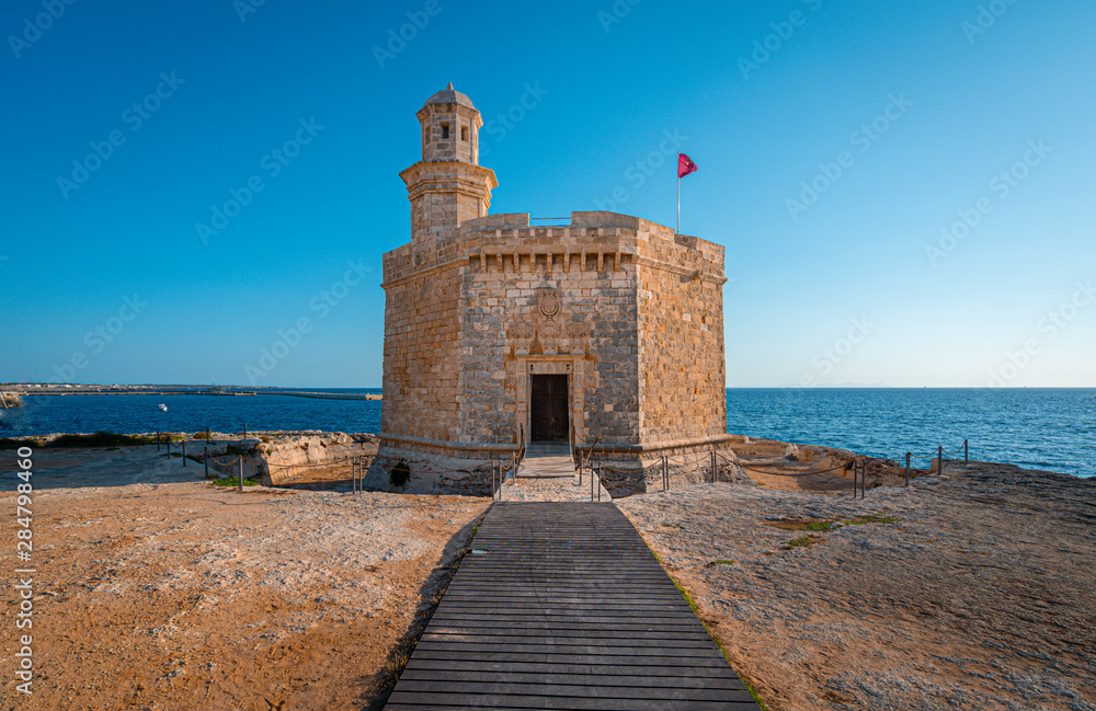 Sant Nicolau Castle in beautiful mediterranean town of Ciutadella in Menorca island. The Sant Nicolau Castle is strategically located at the entrance of the Ciutadella port