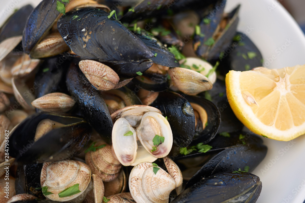 Mussels and clams with lemon, garlic and parsley Mussels and clams with lemon, garlic and parsley