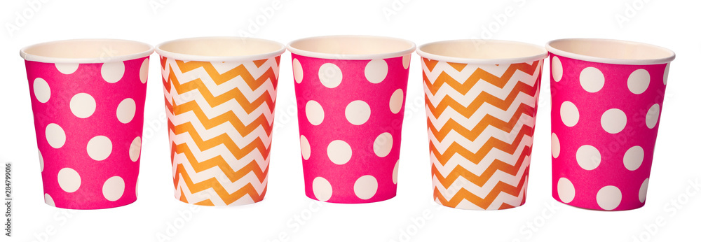 Obraz premium Paper disposable cups with colored pattern isolated on white background