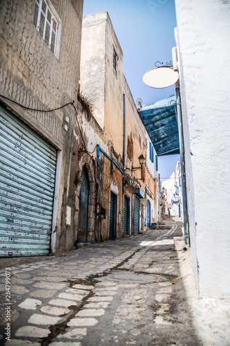 Beautiful street of Medina Sousse in traditional colors. Tunisia. North Africa. © daria_serdtseva