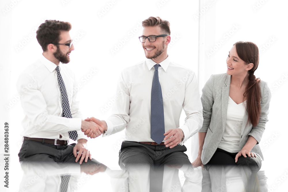 business background. business handshake in the new office business background. business handshake in the new office