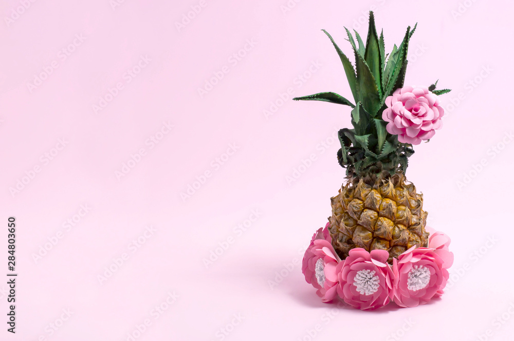 Fototapeta Pineapple decorated with paper flowers