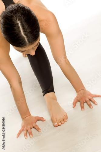 Young flexible yoga woman doing 