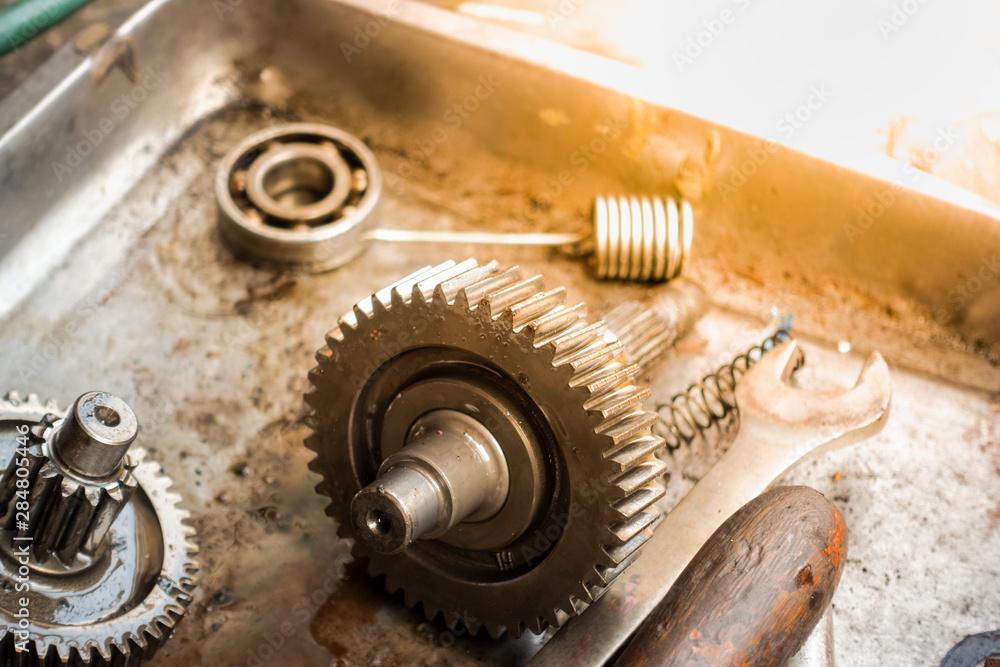 Old shiny motorcycle gears. Disassembly of the engine Old shiny motorcycle gears. Disassembly of the engine