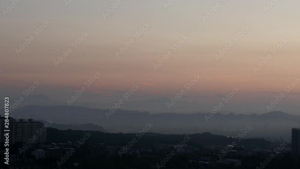 Time lapse of clouds and fog floating around residential places surrounded by mountains Time lapse of clouds and fog floating around residential places surrounded by mountains