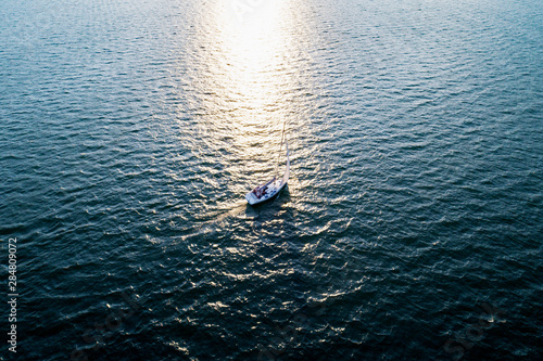 Barca a vela in navigazione - vista aerea photo