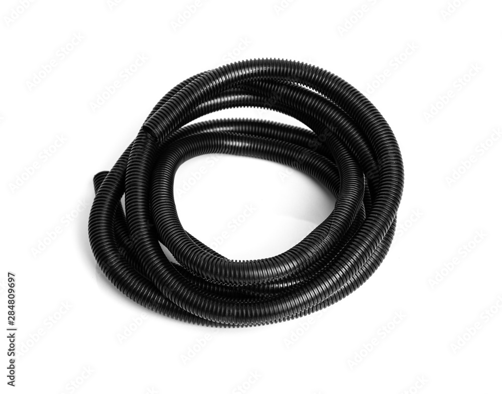 Corrugated black plastic hose for electrical wiring on a white background. Corrugated black plastic hose for electrical wiring on a white background.