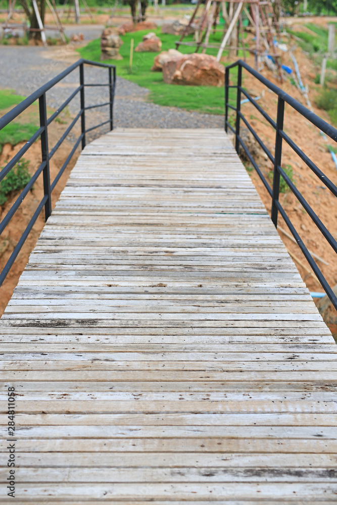 Wooden bridge crossing river to countryside pavilion in Thailand. Wooden bridge crossing river to countryside pavilion in Thailand.