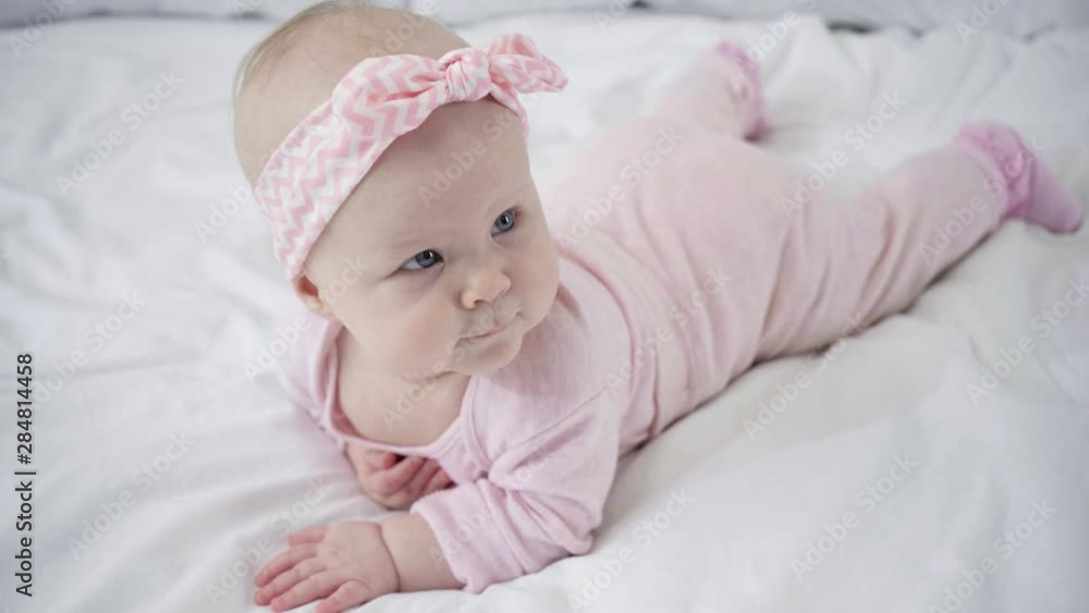selective focus of cute infant lying on bed selective focus of cute infant lying on bed