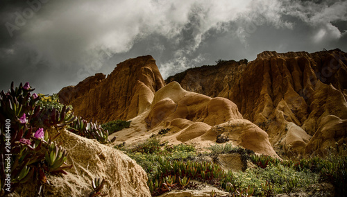 Cliffs in Falesia beach in a cloudy day, Algarve, Portugal. Colorful.