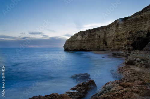 Sunset in the Vale de Centianes Beach, Carvoeiro, Algarve, Portugal. Selective focus and silk effect.